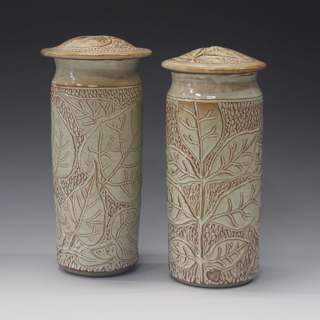A Pair of Hand carved tall Jars. Price per Jar.